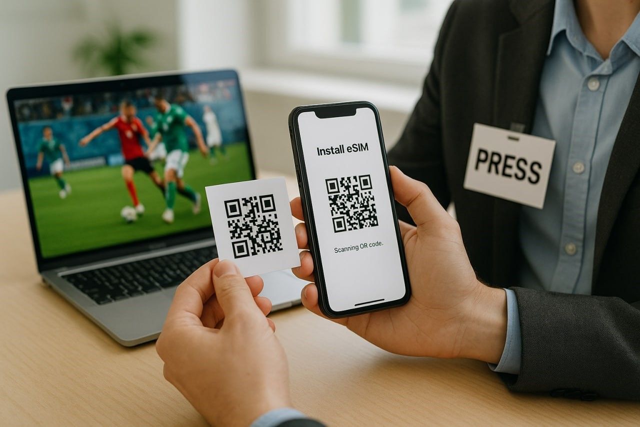 Close-up shot of a journalist scanning a QR code to install an eSIM on their smartphone