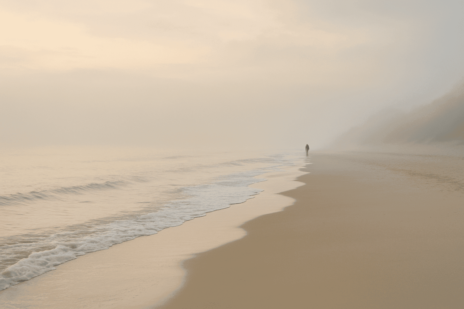 Peaceful beach scene at dawn, illustrating the emotional healing benefits of traveling.