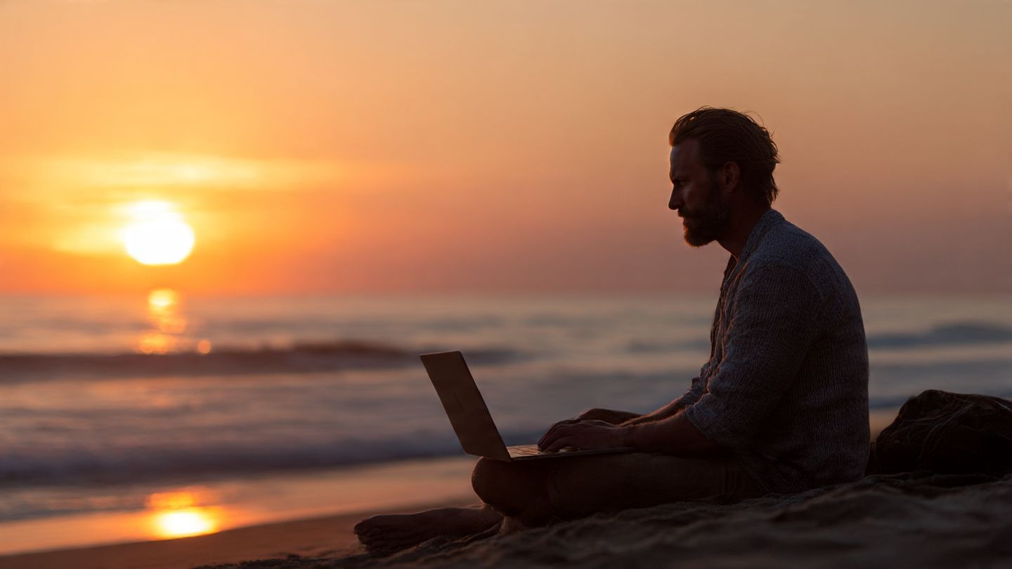 A digital nomad relaxing on a beach with a laptop, streaming German TV via eSIM connection — warm sunset tones, calm atmosphere.