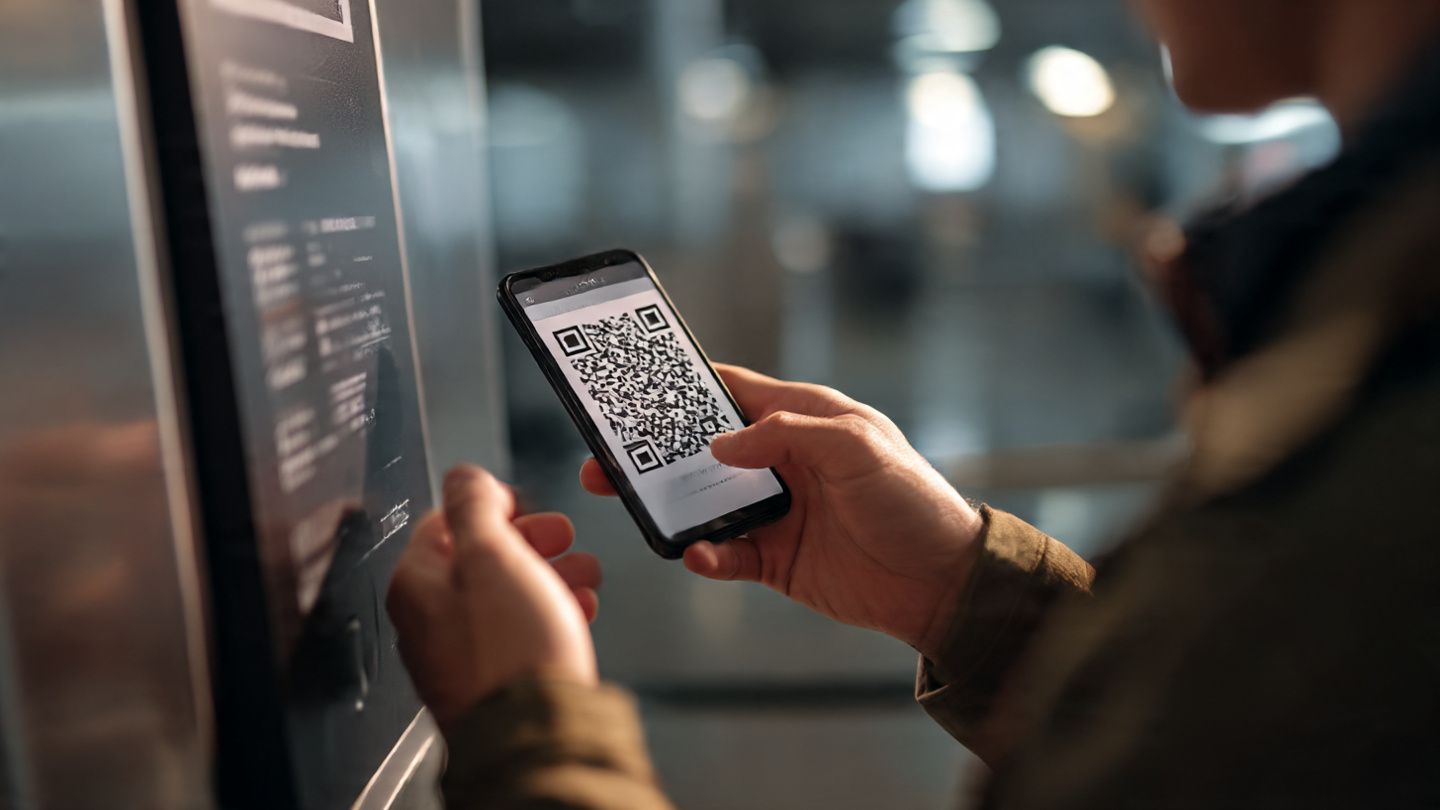 Illustration of a traveler scanning a QR code to activate a Japan eSIM — clean, modern, and tech-oriented.