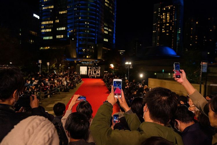 Attendees using phones on the red carpet at TIFF, Tokyo