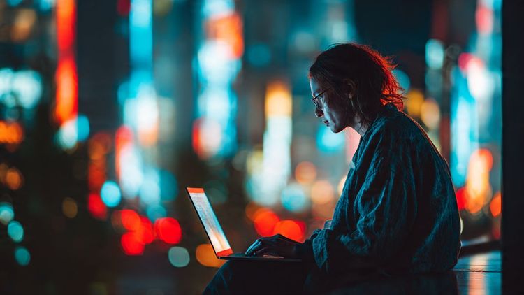 A digital nomad using a laptop with AI tools open, connected through an eSIM while traveling in Tokyo – futuristic tone, vibrant lighting, productivity on the go