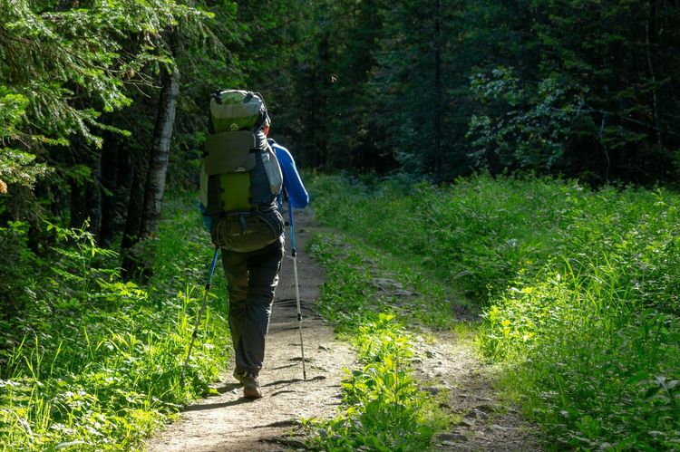 Man hiking with a well-packed rucksack