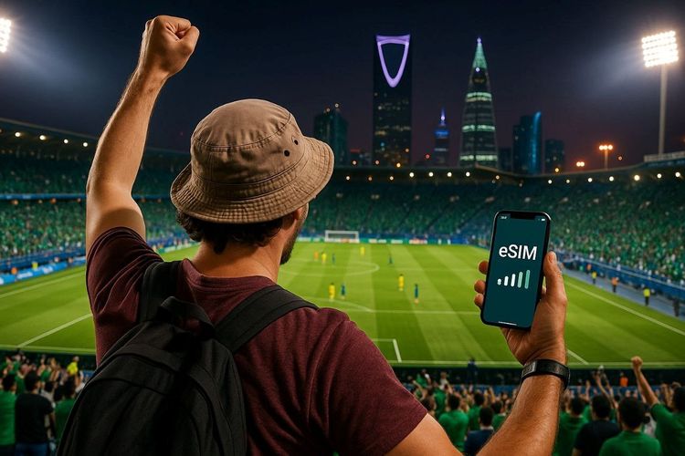 Traveler celebrating in a Saudi Pro League stadium, smartphone in hand showing active eSIM signal,