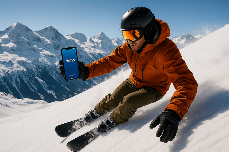 A snowboarder using a phone with a Yoho Mobile eSIM while on a snowy mountain in the Swiss Alps.
