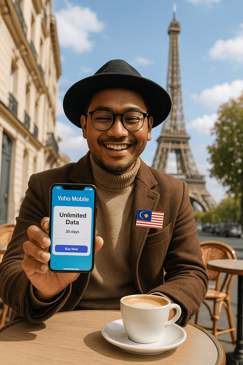 A Malaysian traveler using a smartphone with the Yoho Mobile app in a cafe in Paris, demonstrating easy global connectivity.