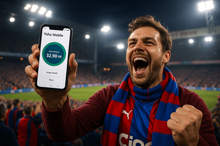 A Crystal Palace fan cheering at Selhurst Park while using a Yoho Mobile eSIM for data.