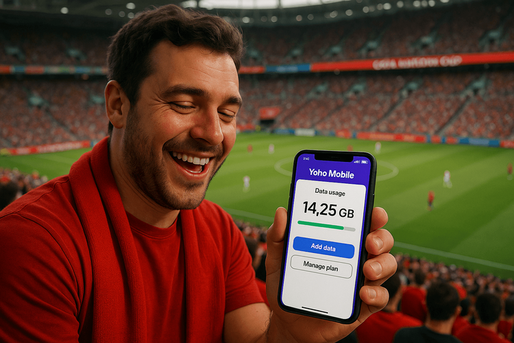 A football fan using a Yoho Mobile eSIM on their phone to stay connected during the CAFA Nations Cup.