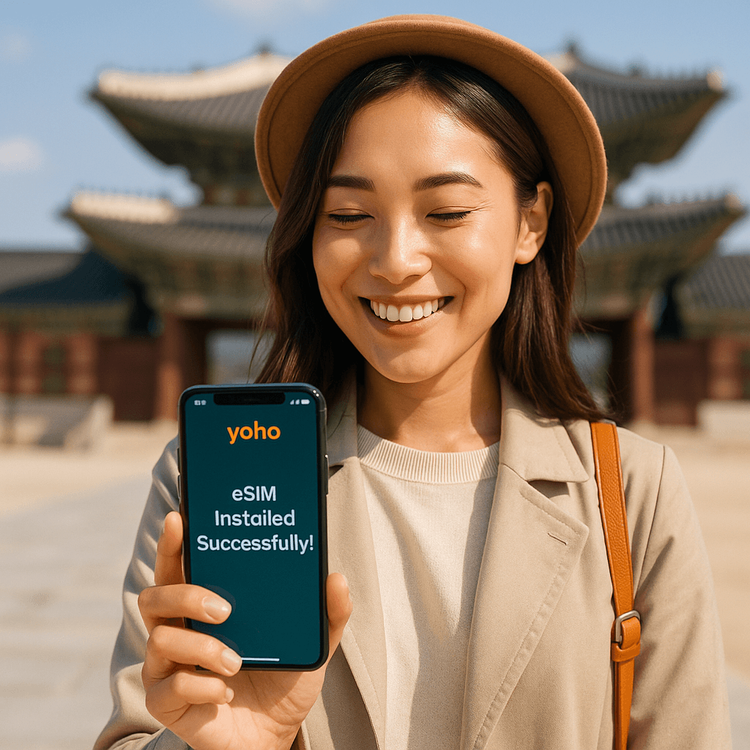 A happy traveler successfully installing her Yoho Mobile eSIM with a beautiful South Korean landmark in the background.