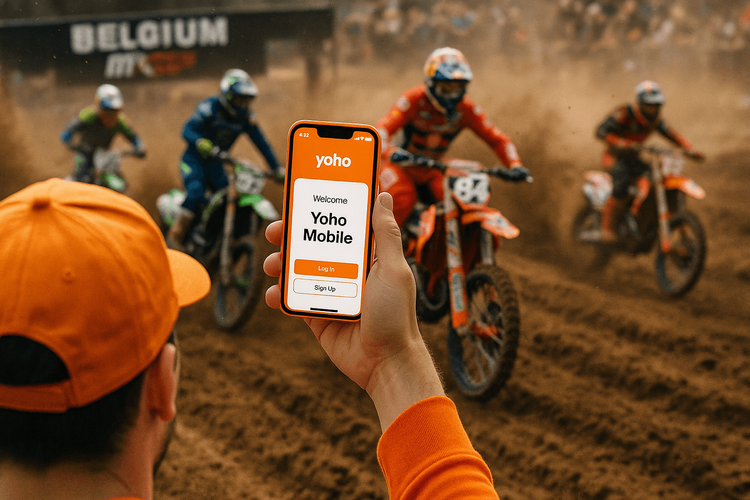 A motocross fan uses their phone with a Yoho Mobile eSIM to stay connected at the MXGP in Belgium.