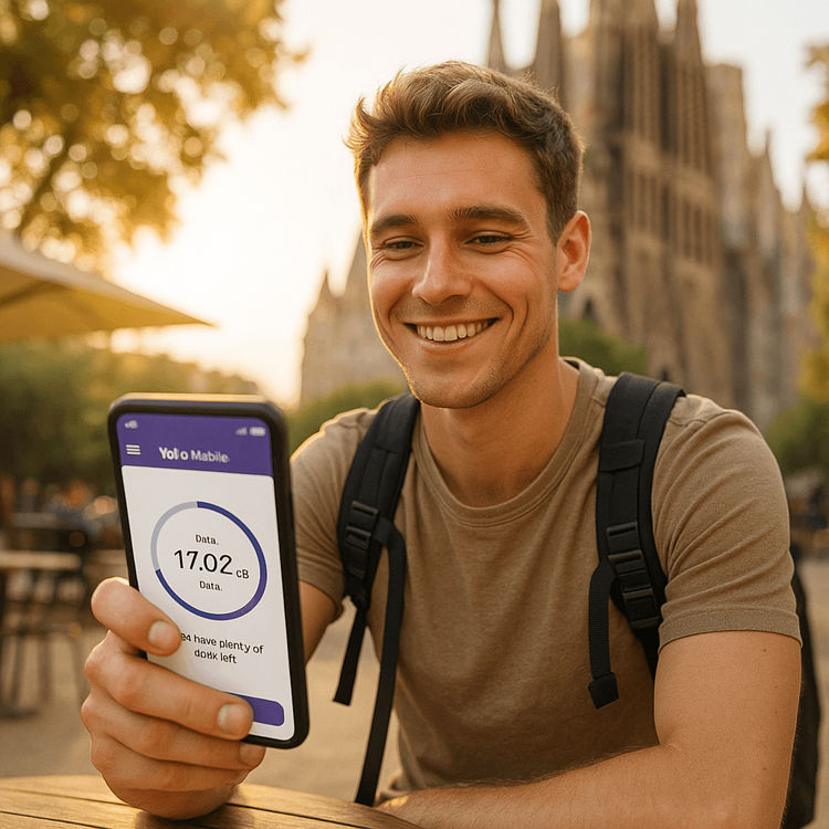 A traveler easily managing his Yoho Mobile eSIM data on his smartphone while enjoying his trip in Barcelona.