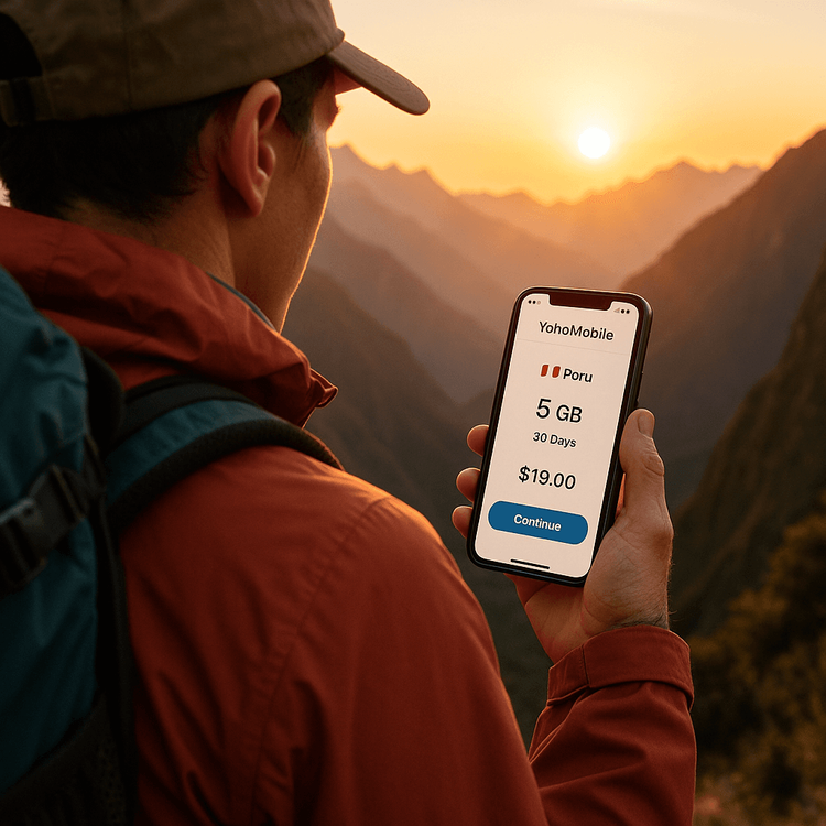 A hiker using the Yoho Mobile app on their smartphone to manage their Peru eSIM data plan in the Andes.