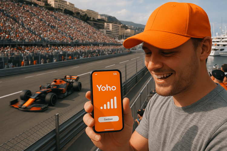 A Formula 1 fan using a Yoho Mobile eSIM for great connectivity at the Monaco Grand Prix.