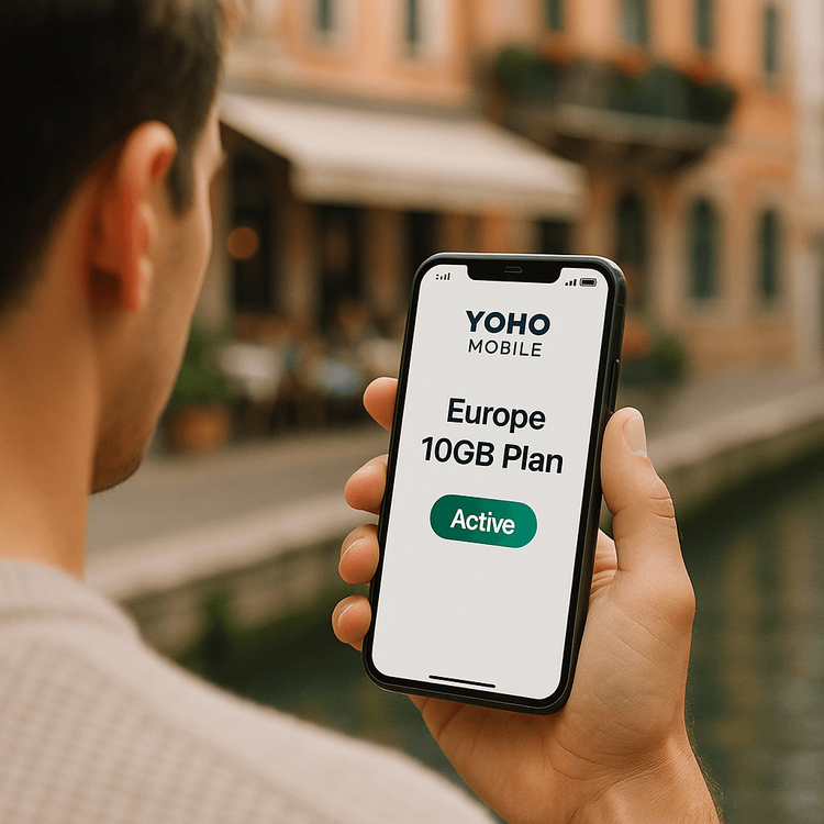 A smartphone displaying an active Yoho Mobile Europe eSIM plan with full signal, held by a traveler in a European city.