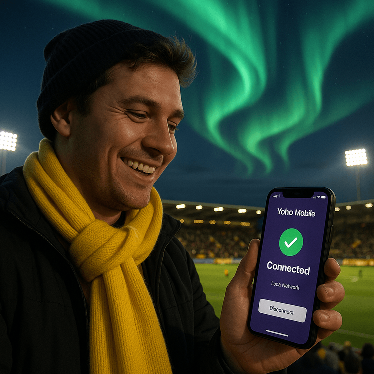 A football fan using a Yoho Mobile eSIM in Norway to stay connected at a Bodø/Glimt match under the Northern Lights.