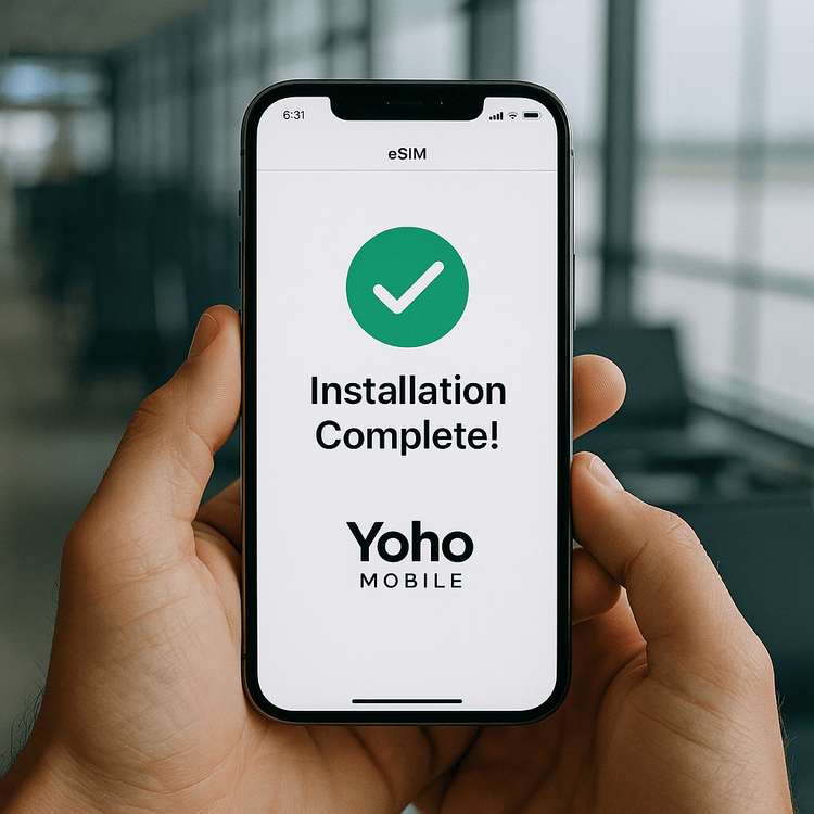 A user successfully completes the one-click installation of a Yoho Mobile eSIM on their iPhone before their trip.