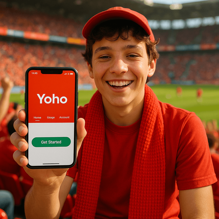 A happy football fan using a Yoho Mobile eSIM on their smartphone to stay connected at a crowded stadium.