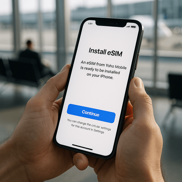 A traveler easily installing a Yoho Mobile eSIM on their iPhone before their trip.