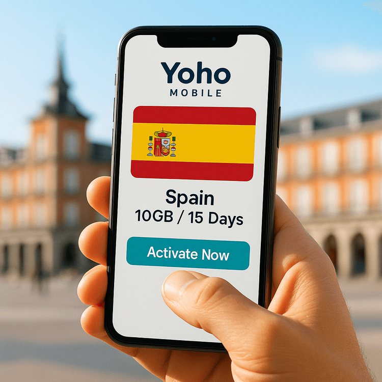 Activating a Yoho Mobile eSIM plan for Spain on a smartphone with a Madrid landmark in the background.