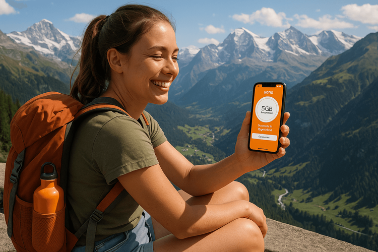 A traveler staying connected in the Swiss Alps with her Yoho Mobile eSIM data plan.