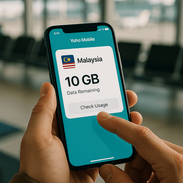 A traveler managing their Yoho Mobile Malaysia eSIM data plan on their smartphone while waiting at the airport.