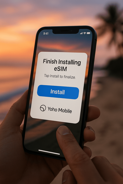 A user easily installing a Yoho Mobile eSIM on an iPhone with a Bali beach in the background.