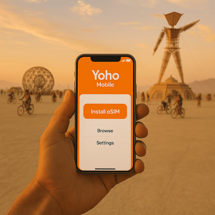 A person holding a smartphone with the Yoho Mobile eSIM app, preparing for connectivity at Burning Man 2025.