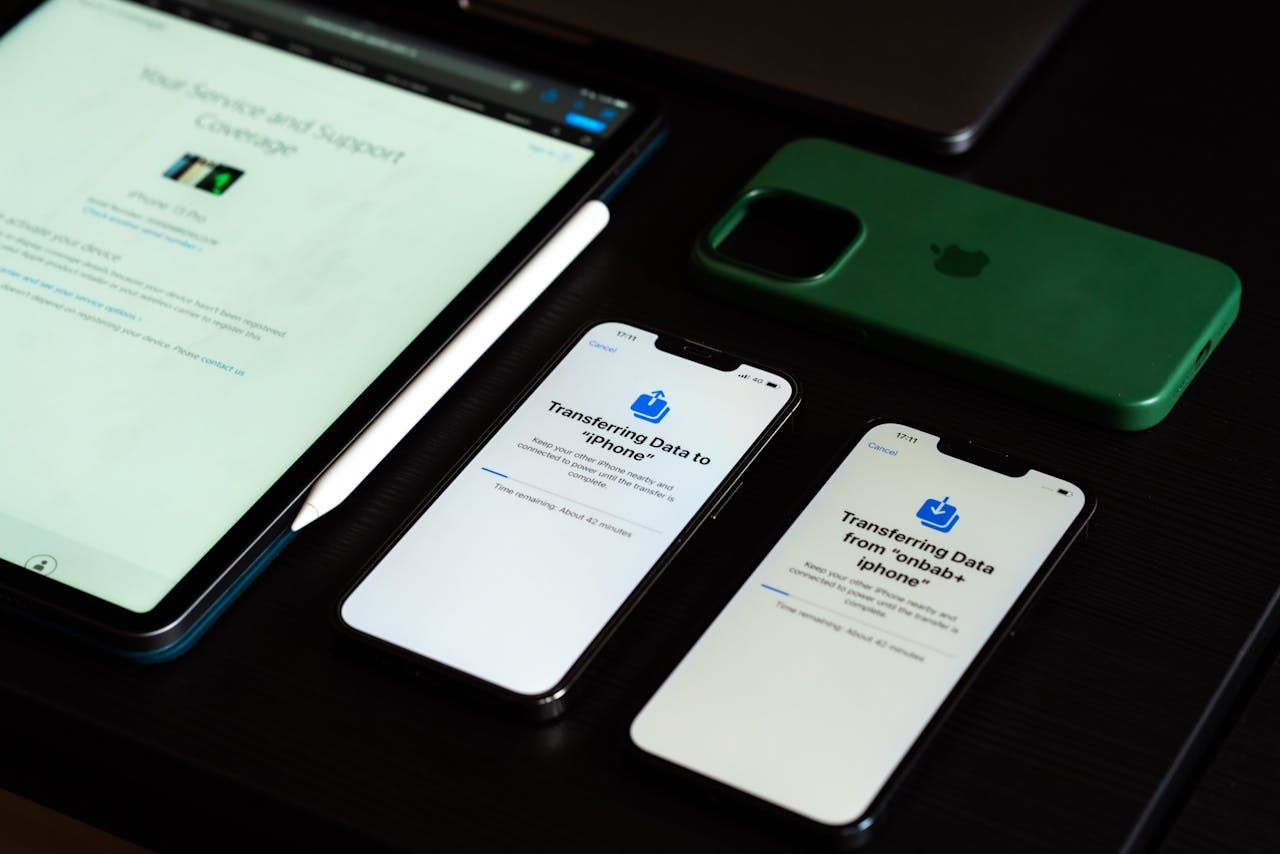 Tablet and iphones Lying on Desk